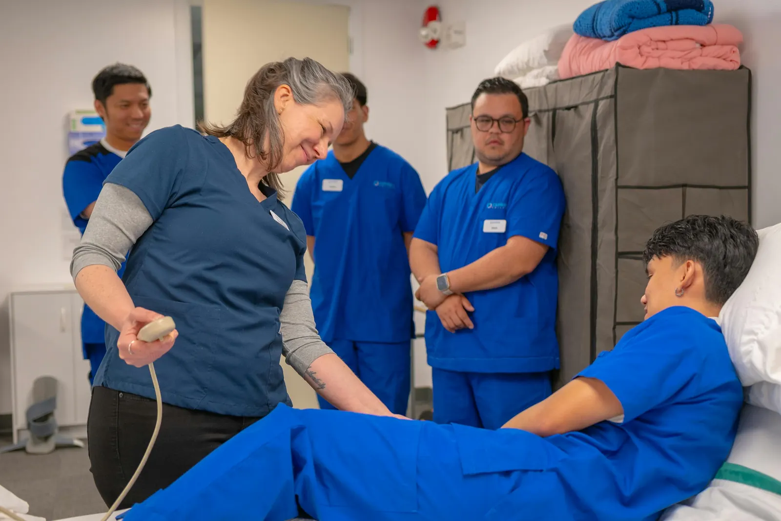 A real clinic team caring for a patient — organised, in flow